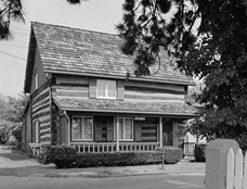 Two Story Log Cabin with Front Porch